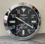 BREITLING  wall clock silver steel with the iconic fluted bezel.