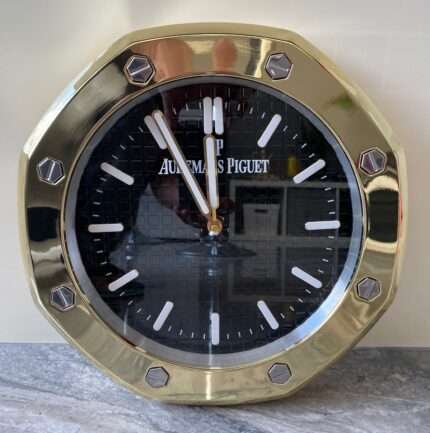 Luxurious stainless steel wall clock based on yellow gold bezel and black face