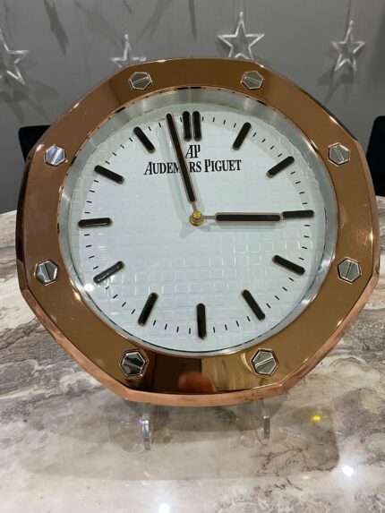 vLuxurious stainless steel wall clock based on yellow gold bezel and white face