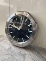 Luxurious stainless steel wall clock based on silver bezel and black face