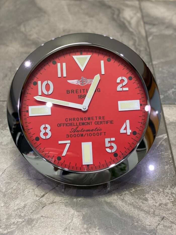 BREITLING wall clock based on red bezel and silver face 