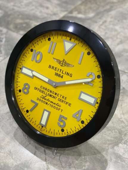 Luxurious stainless steel wall clock based on satin black bezel and yellow face