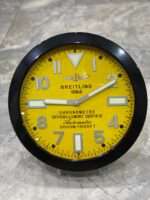 Luxurious stainless steel wall clock based on satin black bezel and yellow face