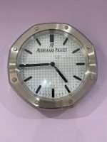 Luxurious stainless steel wall clock based on silver bezel and white face and black dial