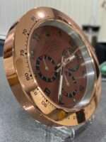 DAYTONA in rose gold bezel and brown face.