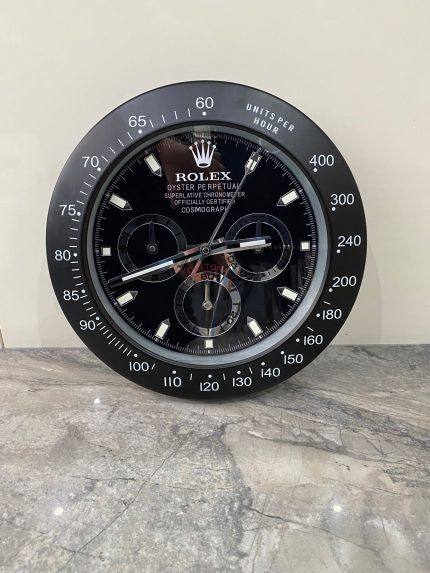 DAYTONA Wall Clock stainless steel with black bezel and black face.