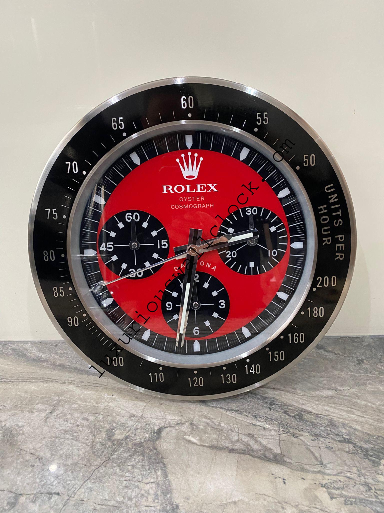 DAYTONA Wall Clock stainless steel with black bezel and red face. DAYTONA Wall Clock stainless steel with black bezel and red face.