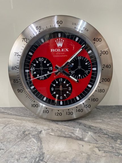 DAYTONA Wall Clock stainless steel with satin silver bezel and red face.