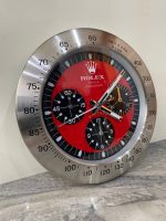 DAYTONA Wall Clock stainless steel with satin silver bezel and red face.