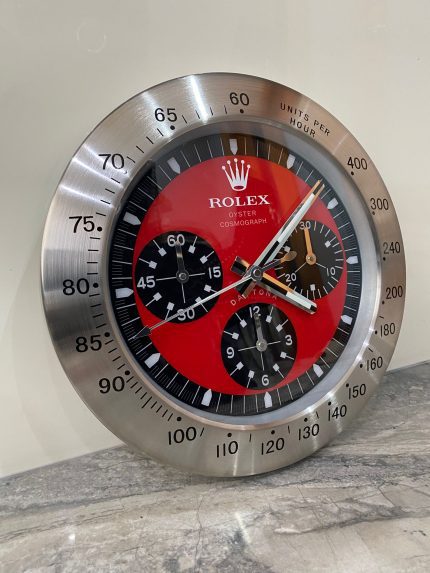 DAYTONA Wall Clock stainless steel with satin silver bezel and red face.