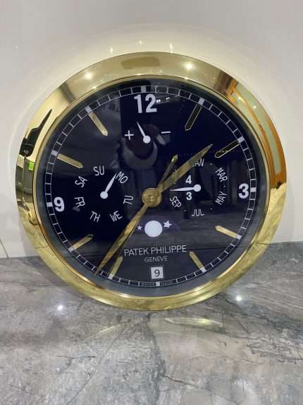 PATEK PHILIPPE Wall Clock | Yellow gold bezel and black face