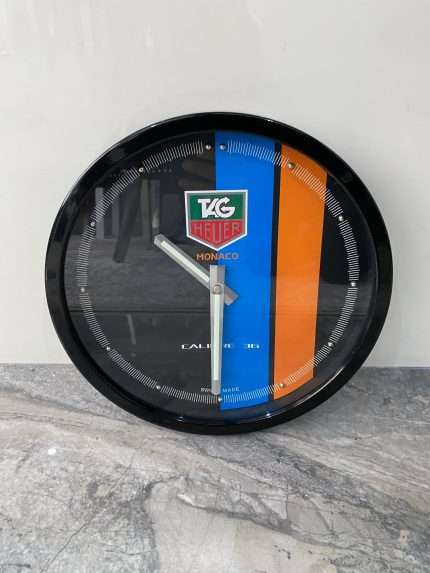 Luxurious wall clock TAG HEUER in black bezel with black face