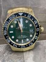 Rolex GM MASTER II stainless steel yellow gold – black bezel and green face.